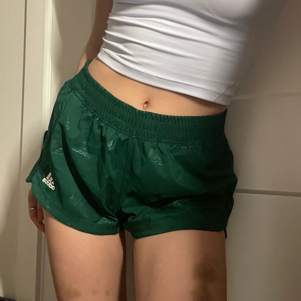 Green reflective adidas running shorts